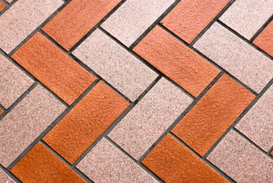 alternating beige and red-orange color brick flooring