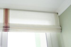A window with roman shades.