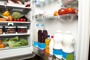 An open refrigerator filled with food.