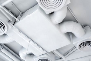 a large ventilation system on a white ceiling