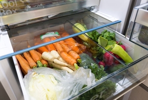A refrigerator drawer full of produce.
