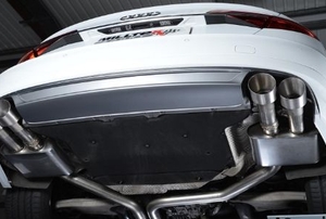 Looking up at an aftermarket exhaust system underneath a vehicle.