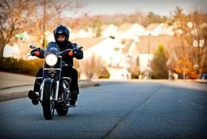 a person driving a motorcycle