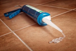 silicone leaking out of a caulking gun