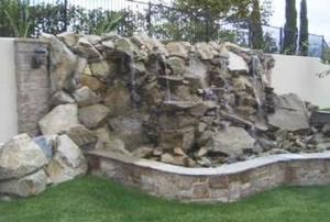 concrete waterfall in a backyard