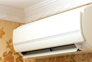 An AC splitter unit mounted on a wall.
