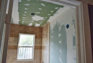 Room with greenboard and spackle on walls