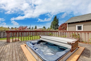 A hot tub with a cover.