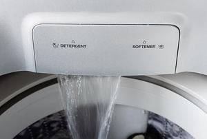 water pouring into a washing machine.