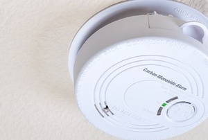 Carbon monoxide detector on home ceiling.