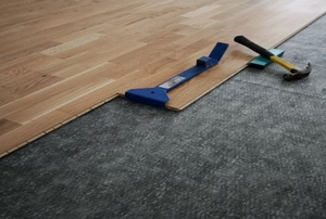 Installing laminate flooring.
