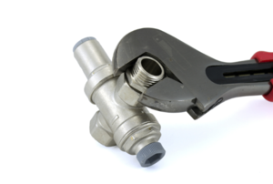 wrench holding a water pressure regulator