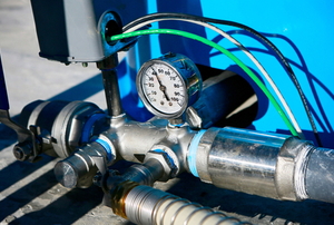 deep well pressure gauge attached to pipes