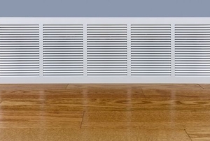 baseboard heater next to a wooden floor
