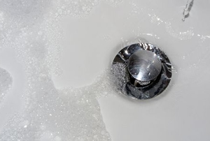 bath tub with pop up drain and soapy water