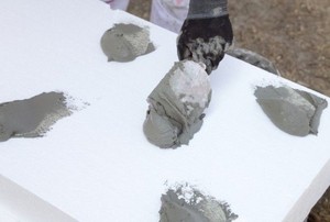 applying adhesive to foam board