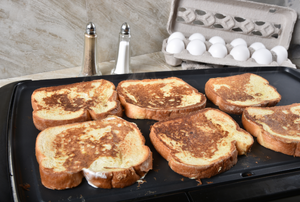 french toast cooking on a griddle