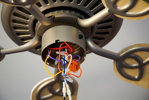 The inside of a ceiling fan in the process of installation.