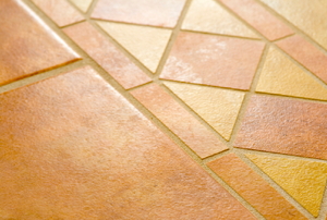 A pattern set into a ceramic tile floor.