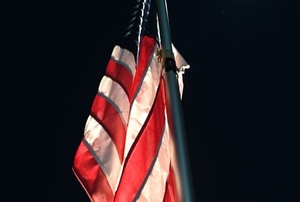 illuminated American flag on pole