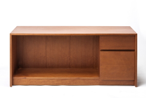 An isolated, veneered desk against a white background.