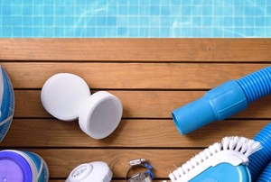pool filter supplies next to a pool