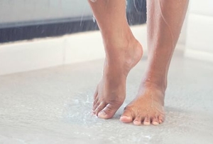 feet in a shower on the wet floor