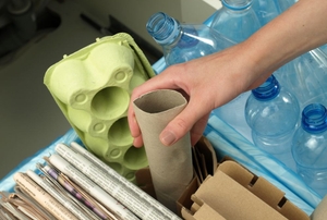 A woman recycles.