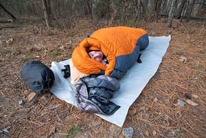 Sleeping bag on a mat outdoors