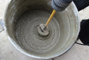 Mixing a small batch of concrete for a footer.