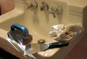 Wall-mounted sink with painting tools