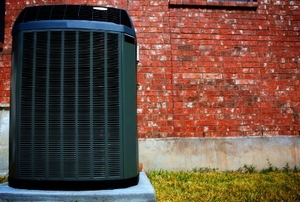High efficiency modern heat pump unit, energy save solution in front of brick wall.