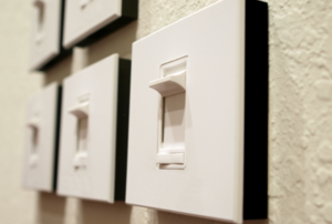row of light switches on a wall