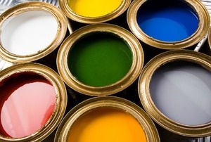 Cans of colorful paint.