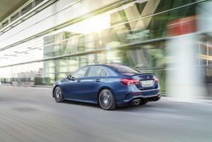 A blue car on the road.