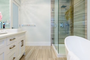 bathroom with cabinets, shower and bath