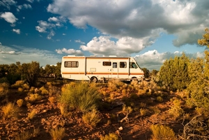 an RV surrounded by desert landscape