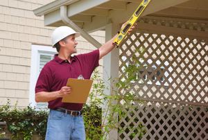 A contractor working on a house.