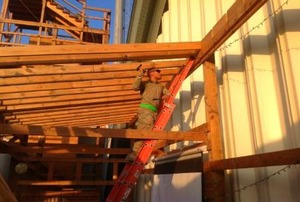 A soldier building a deck in Afghanistan.