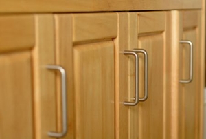 A series of lower cabinet doors with steel handles.