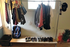 Industrial style clothing rack.
