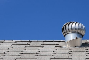 attic vent fan on shingled roof