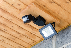 an outdoor motion sensored light mounted to the roof