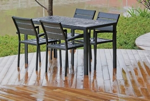 outdoor wood furniture on wet curved deck
