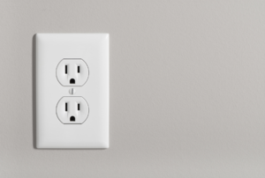 electrical outlet against a beige wall