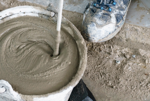 Mixing concrete in a bucket