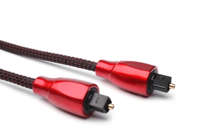 Both ends of a red optical audio cable sit against a white background.