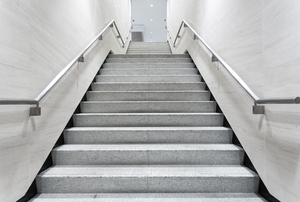 Stairs with a metal railing.