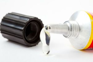 glue oozing out of a tube
