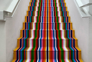 A multi-colored striped set of stairs.
